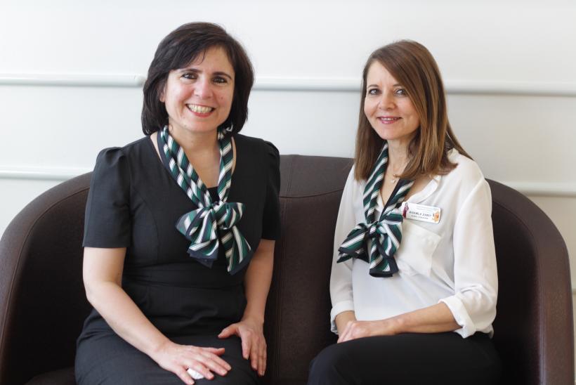 Two interpreters sat on a bench in GOSH