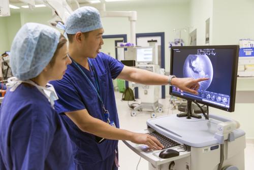 Mr Chien Wong using a RetCam device to review a patient's eye