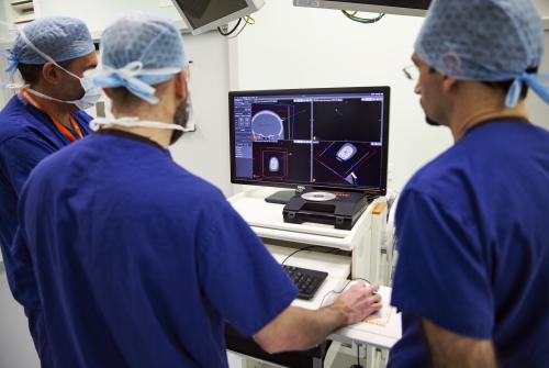 GOSH neurosurgeons reviewing a scan in surgery