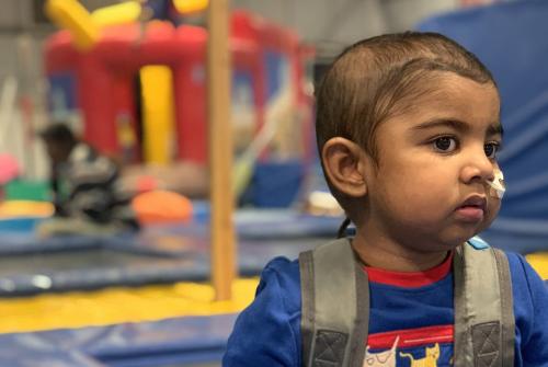 Noah wearing his Blina backpack at a play centre